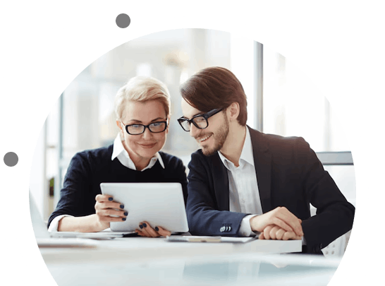 Elderly woman consulting with a realtor about a property deal in a cozy indoor setting.